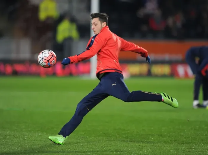 Framed Print : Mesut Ozil's Focus: Arsenal's Preparation for FA Cup Replay vs. Hull City