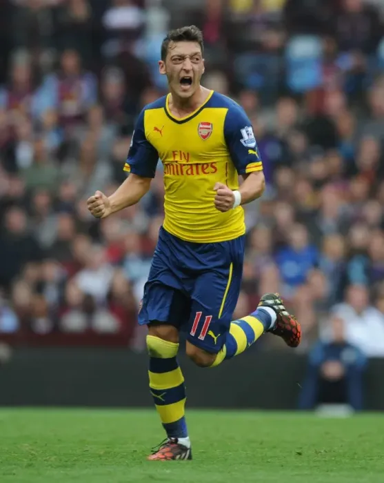 Framed Print : Mesut Ozil's Triumph: Scoring First Goal for Arsenal Against Aston Villa in Premier League 2014-15