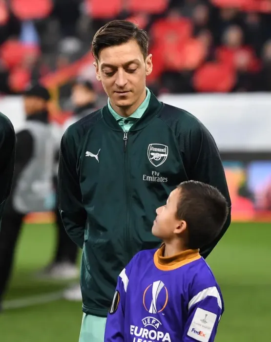 Framed Print : Mesut Ozil's Welcome: Arsenal Players Escorted at Stade Rennais, UEFA Europa League Round of 16 (First Leg)