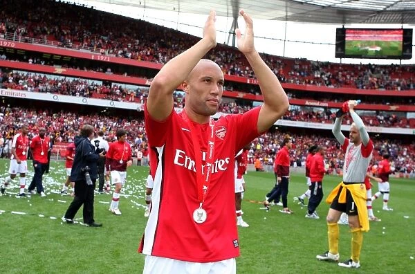 Mikael Silvestre (Arsenal) claps the fans after the match