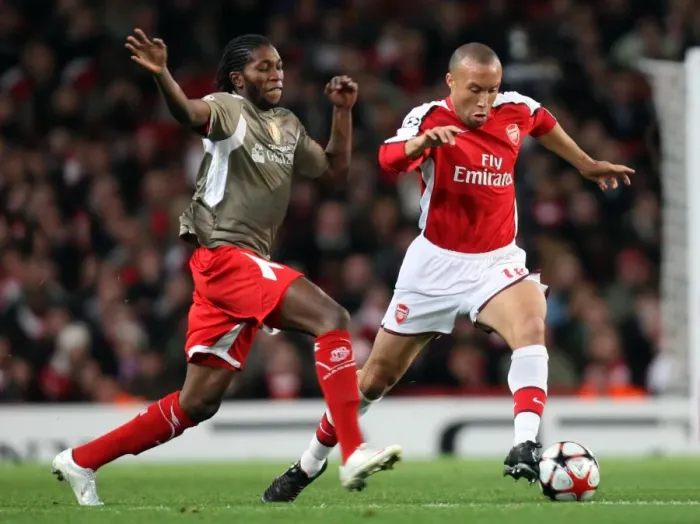 Framed Print : Mikael Silvestre (Arsenal) Dieudonne Mbokani (Liege)