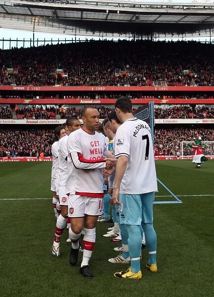 Mikael Silvestre (Arsenal) shakes hands with Kevin McDonald (Burnley). Arsenal 3