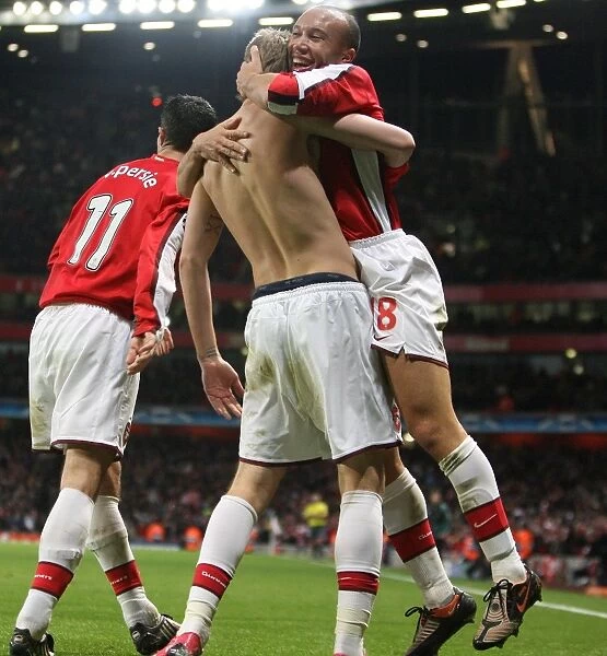 Mikael Silvestre celebrate with goalscorer Nicklas Bendtner