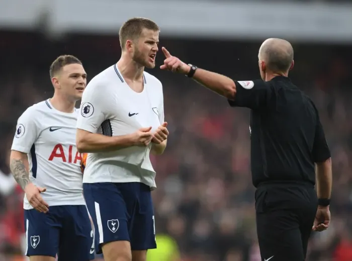 Framed Print : Mike Dean and Eric Dier: A Contentious Moment at the Emirates during Arsenal vs. Tottenham