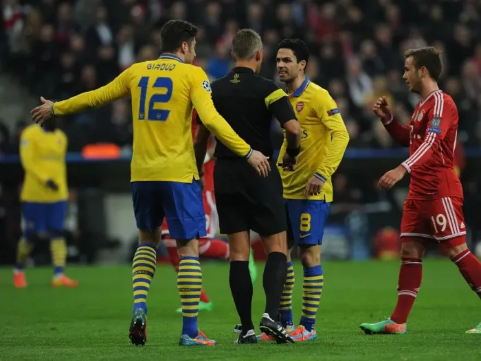 Framed Print : Mikel Arteta Argues with Referee during Tense Bayern Munich vs. Arsenal Champions League Clash