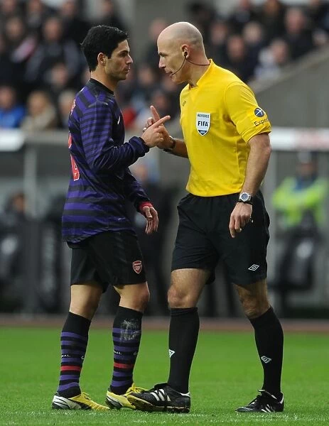 Mikel Arteta Conferring with Referee Howard Webb during Swansea vs Arsenal FA Cup Match