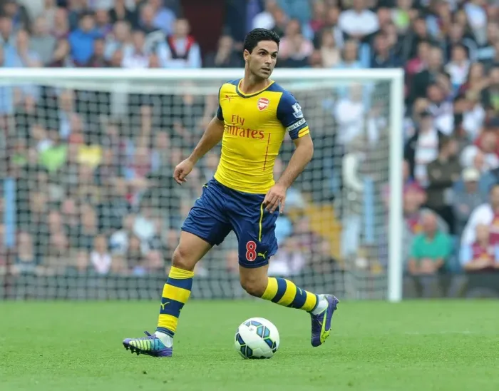 Framed Print : Mikel Arteta Leads Arsenal Against Aston Villa in Premier League (2014-15) Framed Print : Mikel Arteta Leads Arsenal Against Aston Villa in Premier League (2014-15)