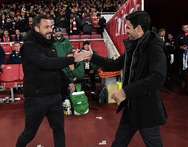 Mikel Arteta and Roberto De Zerbi Exchange Handshakes: Arsenal vs. Brighton in Carabao Cup Clash at Emirates Stadium