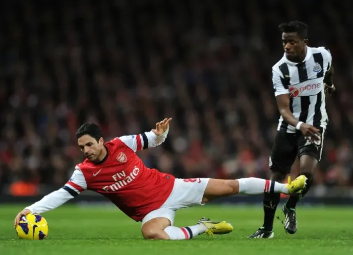 Framed Print : Mikel Arteta vs. Gael Bigirimana: A Battle at Emirates Stadium (Arsenal v Newcastle United, 2012-13) Framed Print : Mikel Arteta vs. Gael Bigirimana: A Battle at Emirates Stadium (Arsenal v Newcastle United, 2012-13)