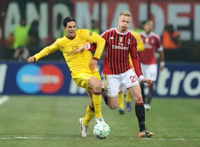 Framed Print : Mikel Arteta vs Ignazio Abate: Intense Clash in AC Milan vs Arsenal UEFA Champions League Match Framed Print : Mikel Arteta vs Ignazio Abate: Intense Clash in AC Milan vs Arsenal UEFA Champions League Match