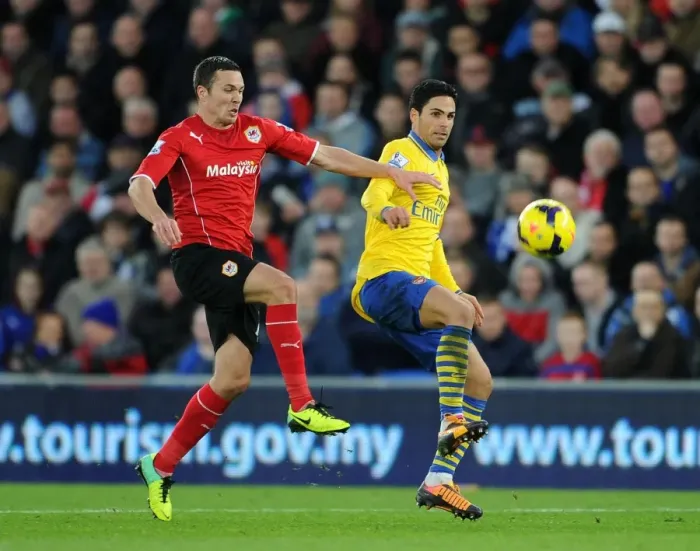 Framed Print : Mikel Arteta vs Jordan Mutch: Intense Clash in Cardiff City vs Arsenal, Premier League 2013-14 Framed Print : Mikel Arteta vs Jordan Mutch: Intense Clash in Cardiff City vs Arsenal, Premier League 2013-14