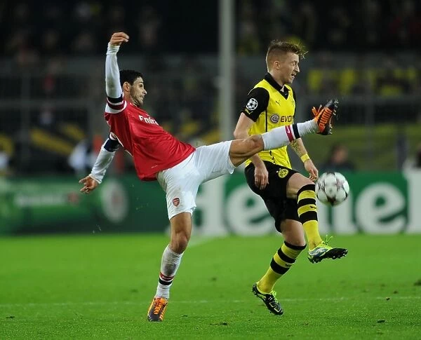 Mikel Arteta vs. Marco Reus: Intense Clash in Borussia Dortmund vs. Arsenal UEFA Champions League Match