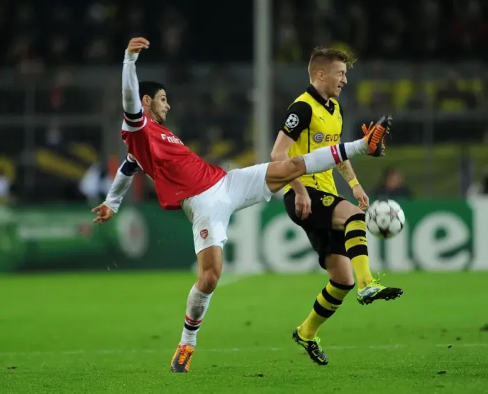 Framed Print : Mikel Arteta vs. Marco Reus: Intense Clash in Borussia Dortmund vs. Arsenal UEFA Champions League Match Framed Print : Mikel Arteta vs. Marco Reus: Intense Clash in Borussia Dortmund vs. Arsenal UEFA Champions League Match