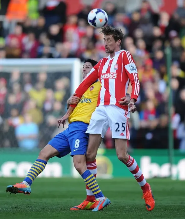 Framed Print : Mikel Arteta vs. Peter Crouch: Intense Clash in Stoke City vs. Arsenal (2013-14)