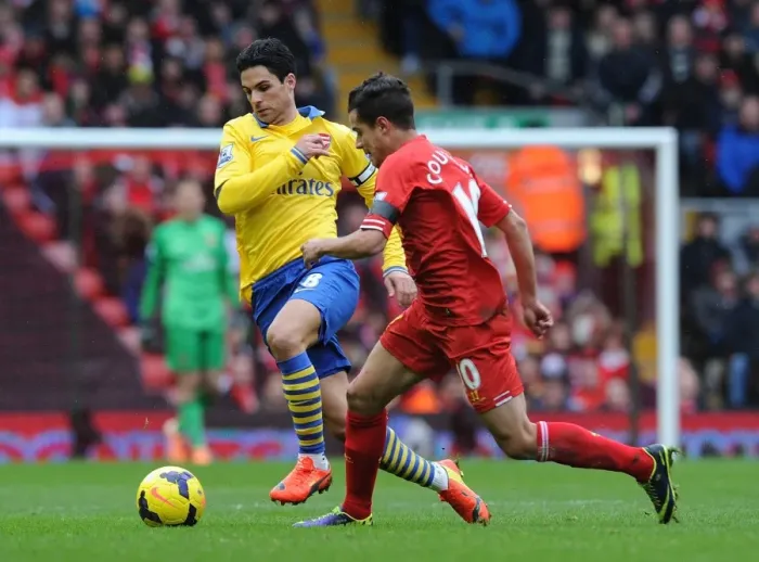 Framed Print : Mikel Arteta vs. Philippe Coutinho: Intense Battle at Anfield (Liverpool v Arsenal, Premier League, 2013-14) Framed Print : Mikel Arteta vs. Philippe Coutinho: Intense Battle at Anfield (Liverpool v Arsenal, Premier League, 2013-14)