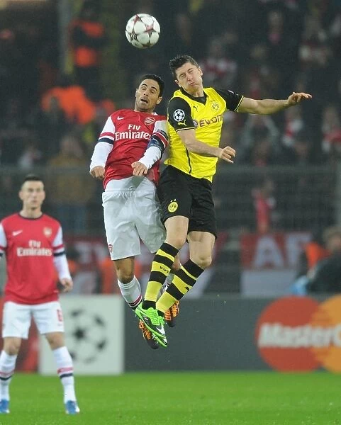 Mikel Arteta vs. Robert Lewandowski: A Battle in the 2013-14 Borussia Dortmund vs. Arsenal UEFA Champions League Match