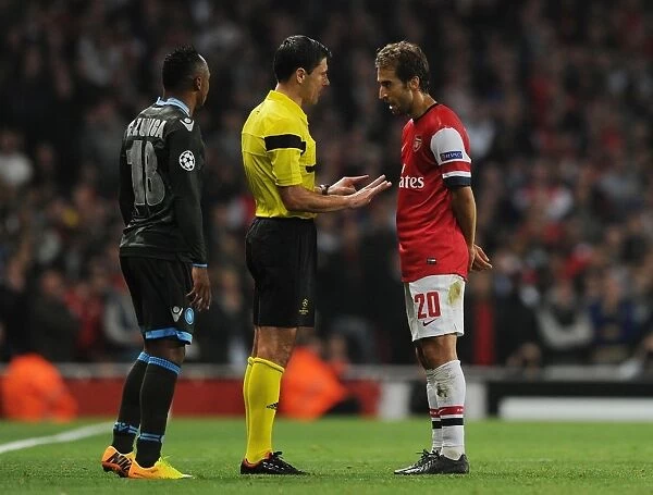 Milorad Mazic Confers with Mathieu Flamini during Arsenal v Napoli UEFA Champions League Match