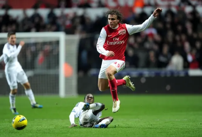 Framed Print : Miquel Leaps Past Dyer: Swansea vs. Arsenal, Premier League Clash (2011-12) Framed Print : Miquel Leaps Past Dyer: Swansea vs. Arsenal, Premier League Clash (2011-12)