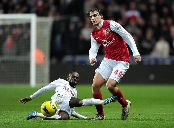 Miquel Leaps Past Dyer: Swansea vs Arsenal, Premier League Clash (2011-2012)