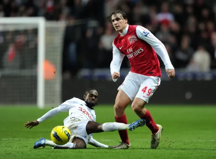 Framed Print : Miquel Leaps Past Dyer: Swansea vs Arsenal, Premier League Clash (2011-2012) Framed Print : Miquel Leaps Past Dyer: Swansea vs Arsenal, Premier League Clash (2011-2012)