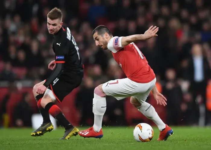 Framed Print : Mkhitaryan Tangles with Bourigeaud: Intense Moment from Arsenal's Europa League Clash with Stade Rennais