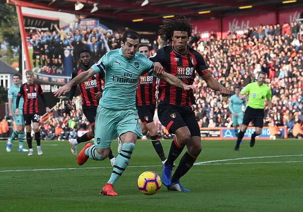 Mkhitaryan vs Ake: An Intense Premier League Showdown between Arsenal's Henrikh Mkhitaryan and AFC Bournemouth's Nathan Ake