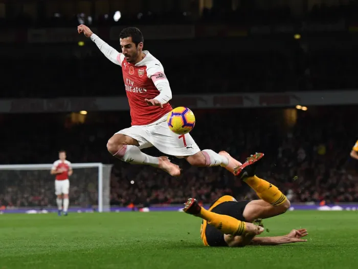 Framed Print : Mkhitaryan vs. Bennett: Intense Face-Off in Arsenal vs. Wolves Premier League Clash Framed Print : Mkhitaryan vs. Bennett: Intense Face-Off in Arsenal vs. Wolves Premier League Clash