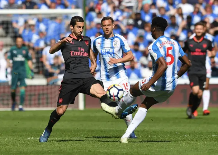 Framed Print : Mkhitaryan vs. Kongolo: Intense Battle for Ball Possession - Huddersfield Town vs. Arsenal (2017-18)