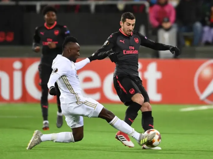 Framed Print : Mkhitaryan vs. Mensah: Intense Clash in Arsenal's Europa League Match against Ostersunds Framed Print : Mkhitaryan vs. Mensah: Intense Clash in Arsenal's Europa League Match against Ostersunds