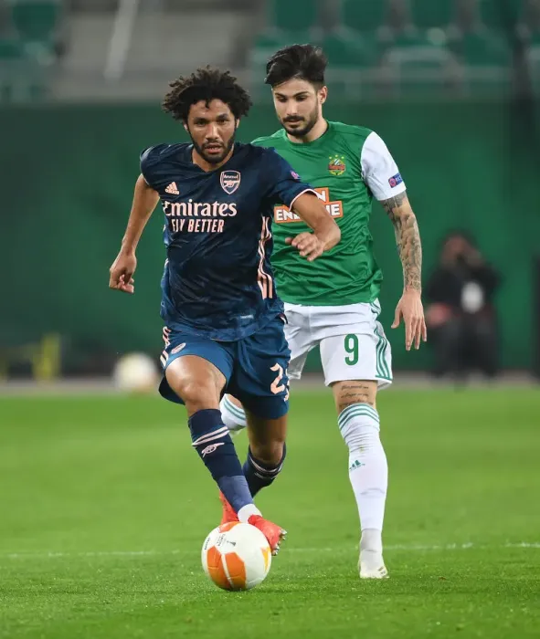 Framed Print : Mo Elneny Breaks Past Rapid Wien's Taxiarchis Fountas in Arsenal's UEFA Europa League Clash Framed Print : Mo Elneny Breaks Past Rapid Wien's Taxiarchis Fountas in Arsenal's UEFA Europa League Clash