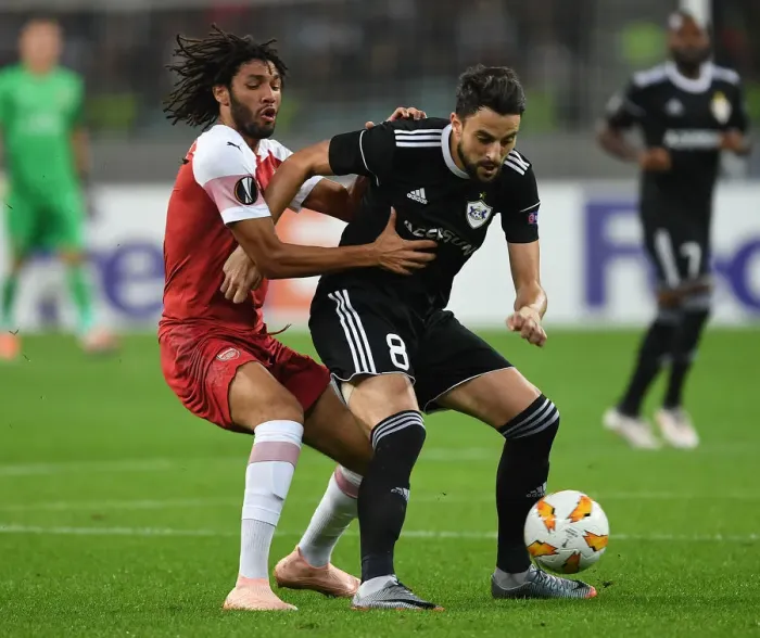 Framed Print : Mo Elneny vs Micel: Intense Clash in Qarabag v Arsenal UEFA Europa League Match Framed Print : Mo Elneny vs Micel: Intense Clash in Qarabag v Arsenal UEFA Europa League Match