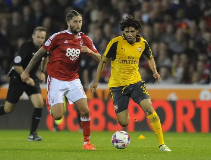 Framed Print : Mohamed Elneny vs. Henri Lansbury: A Battle in the EFL Cup Third Round between Nottingham Forest and Arsenal, 2016-17