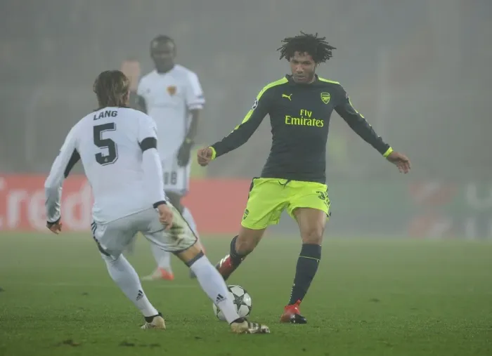 Framed Print : Mohamed Elneny vs Michael Lang: Intense Clash Between FC Basel and Arsenal in the 2016-17 UEFA Champions League Framed Print : Mohamed Elneny vs Michael Lang: Intense Clash Between FC Basel and Arsenal in the 2016-17 UEFA Champions League