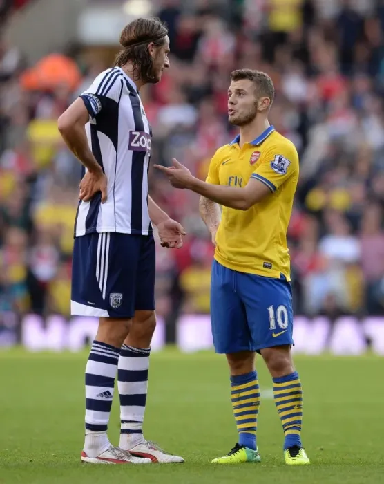 Framed Print : A Moment of Sportsmanship: Wilshere and Olsson's Calm Exchange Amidst West Bromwich Albion vs. Arsenal Rivalry (2013-14)