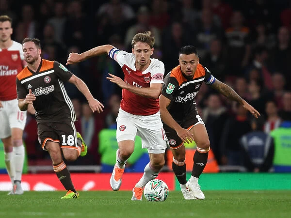 Monreal Overpowers Yennaris: Arsenal vs. Brentford in Carabao Cup