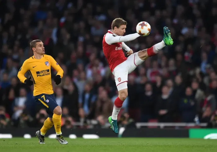 Framed Print : Monreal under Pressure: Arsenal's Nacho Fends Off Griezmann in Europa League Semi-Final Clash