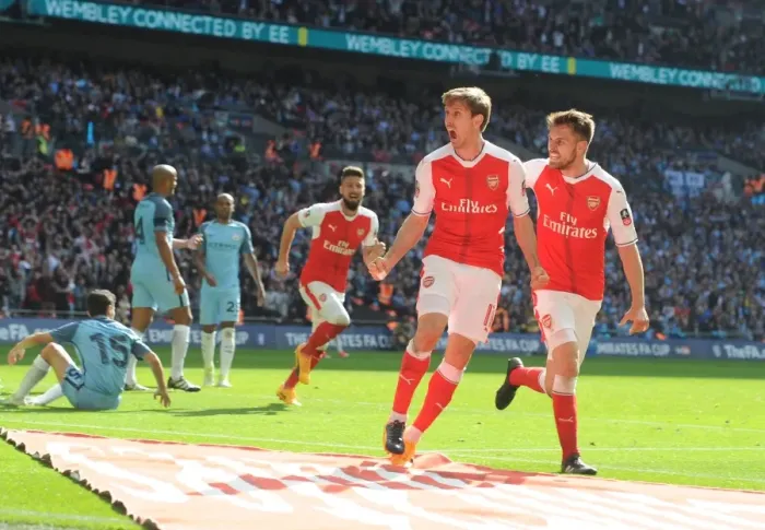 Framed Print : Monreal and Ramsey's Euphoric Moment: Arsenal's FA Cup Semi-Final Goal Against Manchester City