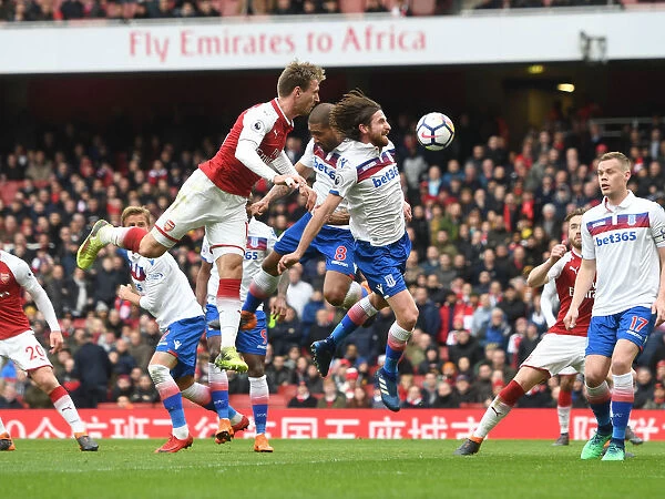 Monreal Soars Over Allen: Arsenal's Defensive Triumph against Stoke City, Premier League 2017-18