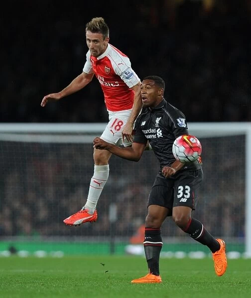 Monreal Soars High: Arsenal Defender Outjumps Ibe in Intense Barclays Premier League Clash (2015 / 16)