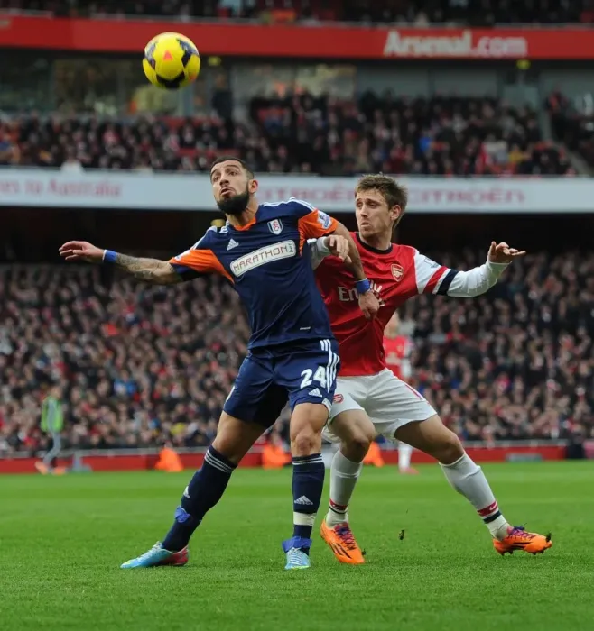 Framed Print : Monreal Stands Firm Against Dejagah: Arsenal vs Fulham, Premier League 2013-14