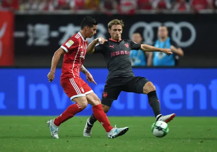 Framed Print : Monreal vs Rodriguez: A Football Rivalry Erupts - Arsenal vs Bayern Munich