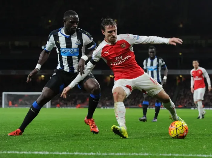 Framed Print : Monreal vs Sissoko: A Premier League Battle at Emirates Stadium (2015-16)