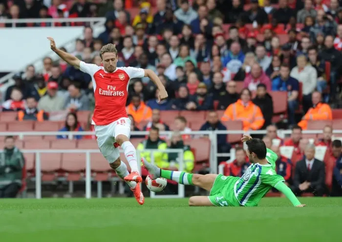 Framed Print : Monreal vs. Trasch: Intense Clash Between Arsenal's Monreal and VfL Wolfsburg's Trasch at Emirates Cup 2015 / 16