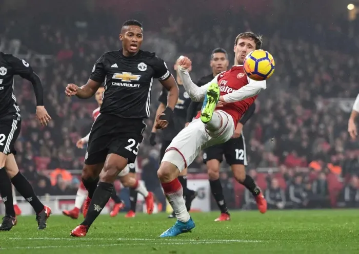 Framed Print : Monreal vs Valencia: Intense Battle at Emirates Stadium - Arsenal vs Manchester United, Premier League 2017-18 Framed Print : Monreal vs Valencia: Intense Battle at Emirates Stadium - Arsenal vs Manchester United, Premier League 2017-18