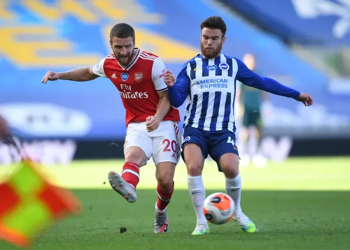 Framed Print : Mustafi Barely Escapes Pressure from Connolly During Arsenal's Tight Battle with Brighton (2020) Framed Print : Mustafi Barely Escapes Pressure from Connolly During Arsenal's Tight Battle with Brighton (2020)