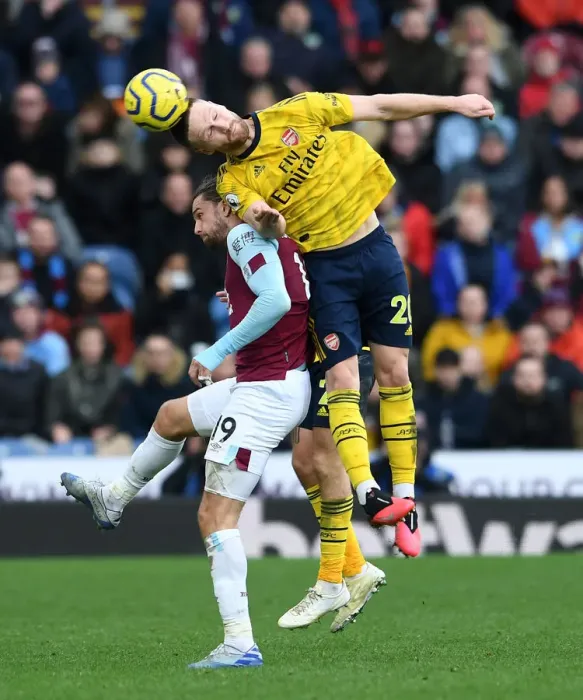 Framed Print : Mustafi Heads Off Burnley Challenge: Arsenal vs. Burnley, Premier League 2019-20
