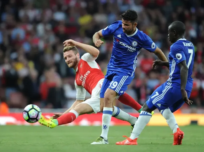 Framed Print : Mustafi Stops Costa: Intense Tackle in Arsenal vs. Chelsea Premier League Clash, 2016-17