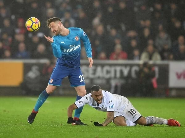 Mustafi vs Ayew: A Battle of Strength and Skill in the Swansea vs Arsenal Clash (2017-18)