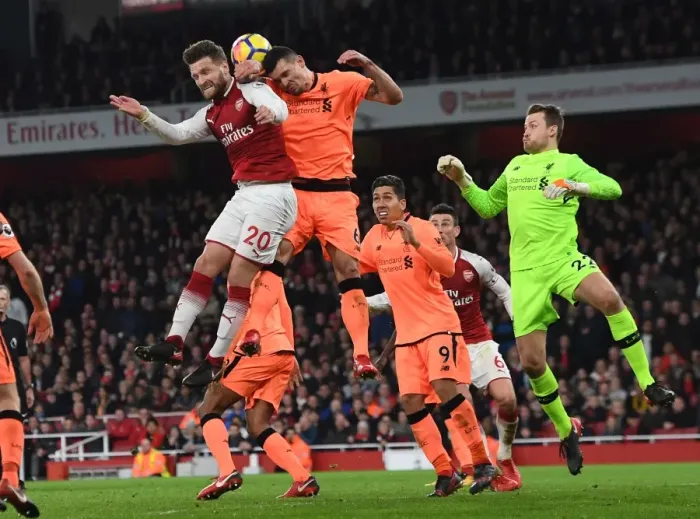 Framed Print : Mustafi vs. Lovren: Intense Clash Between Arsenal and Liverpool Players