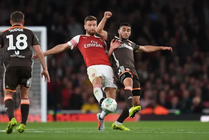 Framed Print : Mustafi vs Maupay: Clash at the Emirates - Arsenal vs Brentford, Carabao Cup 2018-19